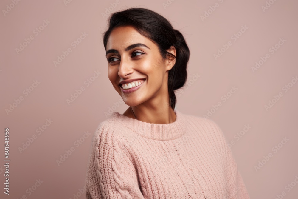 Portrait of a smiling young woman looking at camera isolated on a pink background Portrait of a smiling young woman looking at camera isolated on a pink background