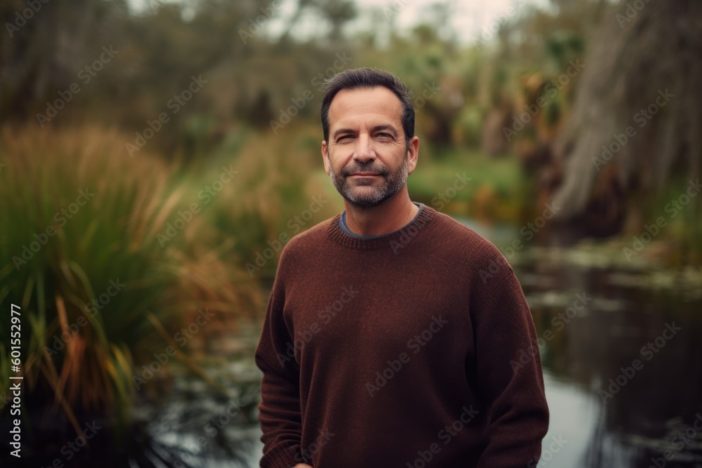 Portrait of a handsome man with beard and mustache in a brown sweater Portrait of a handsome man with beard and mustache in a brown sweater