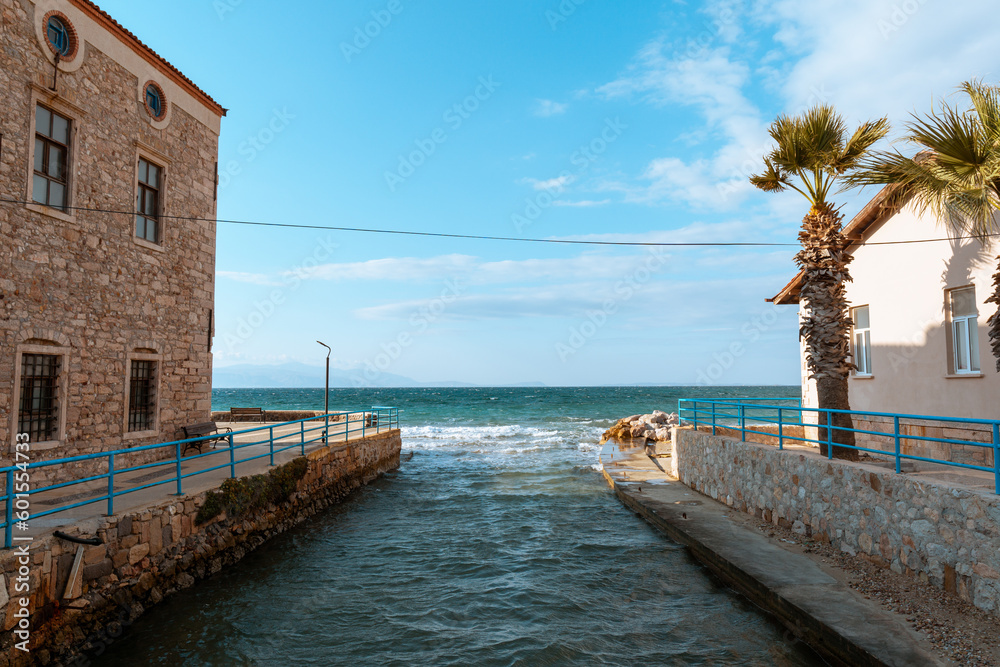 view of sea and clouds between two buildings