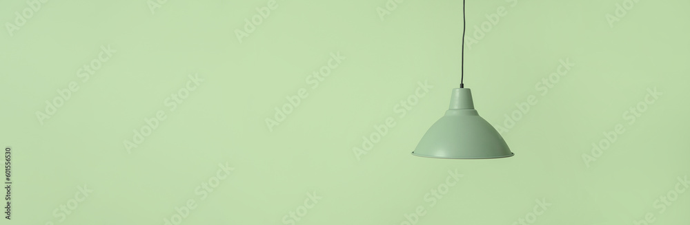 Ceiling lamp on green background with space for text Ceiling lamp on green background with space for text