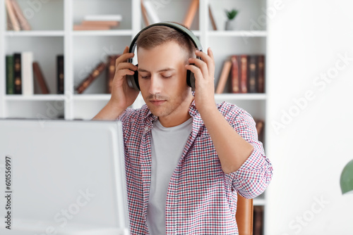 Young man with headphones a...