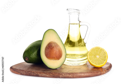 Cooking oil, lemon and fresh avocados isolated on white