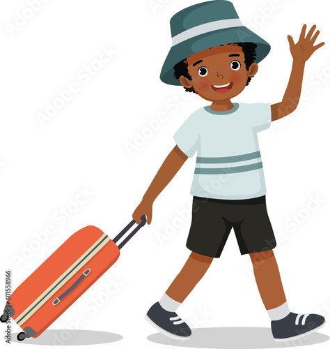 Cute little African boy with hat going on summer vacation traveling with suitcase waving hand