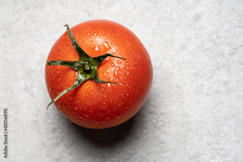 Fresh tomato on neutral background
