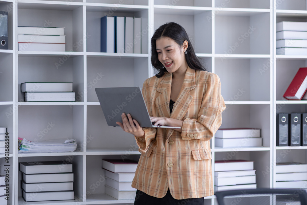 © David - Young asian woman, professional entrepreneur standing in office clothing, smiling and looking confident, plan office space after working hours, © David - Young asian woman, professional entrepreneur standing in office clothing, smiling and looking confident, plan office space after working hours,