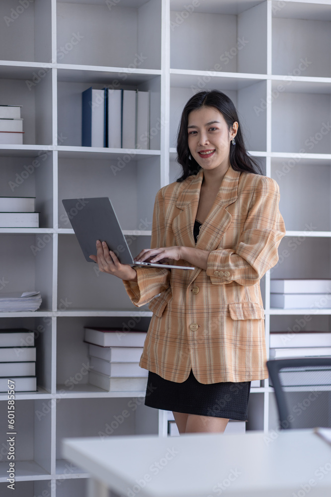 © David - Young asian woman, professional entrepreneur standing in office clothing, smiling and looking confident, plan office space after working hours, © David - Young asian woman, professional entrepreneur standing in office clothing, smiling and looking confident, plan office space after working hours,