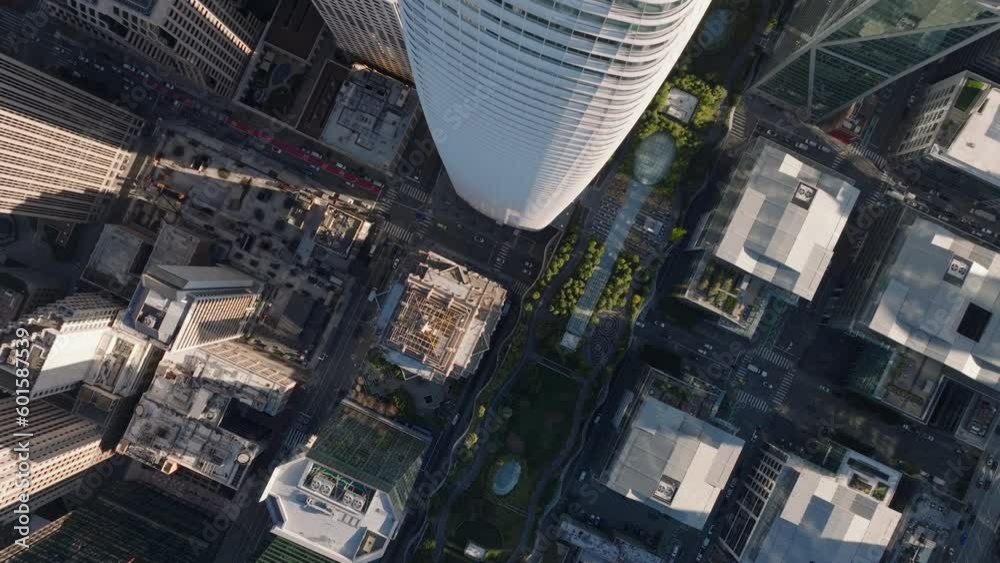 Top down panning footage of downtown skyscrapers. Fly over Salesforce Tower. San Francisco, California, USA