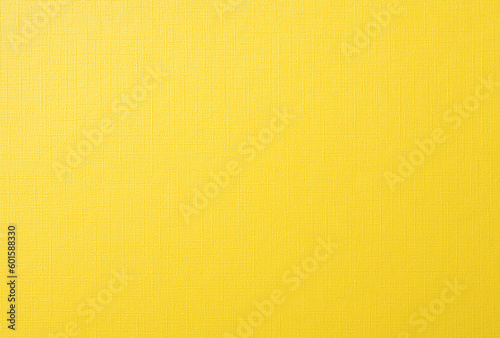 キャンバス風の質感のある黄色い紙の背景テクスチャー