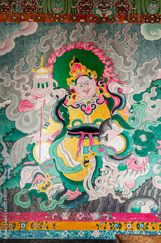 Sikkim, India - 22nd March 2004 : Beautiful colorful Buddist murals , piece of graphic artwork that is painted directly to inside wall of a Monastery. Often murals depict earlier births of God Buddha.