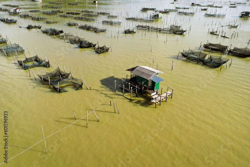 aerial view of traditional fish farm during sunset time in Sangkla -Thailand  photo