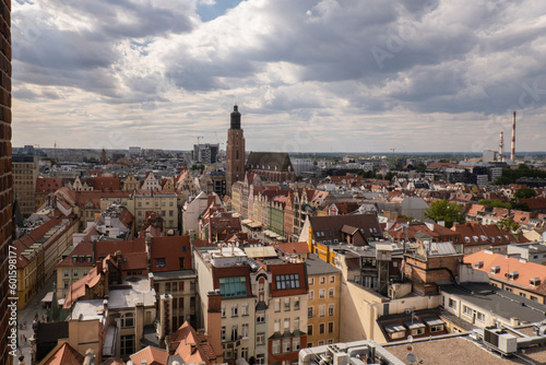 View from above, aerial Wroclaw central market square with old houses. Historical capital of Silesia, Europe. City hall architecture buildings. Old town landmark cathedrals church. Travel tourist