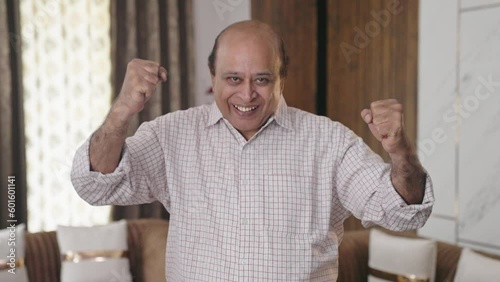 Old Indian uncle cheering and celebrating