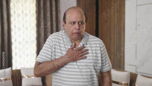 Fat Indian old man having an Asthma attack