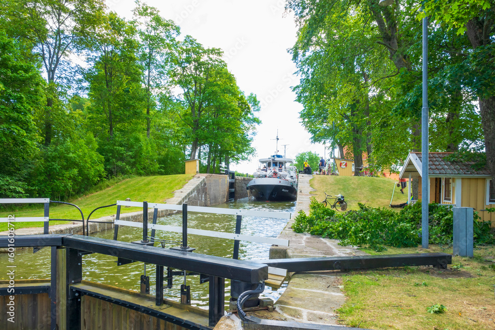 Tourist boat on the way into a lock area Tourist boat on the way into a lock area