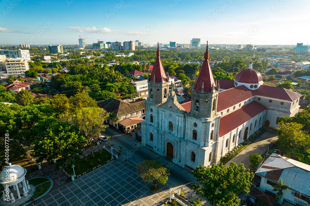 Iloilo City, Philippines - Morning aerial of Molo Church, also known as Saint Anne Parish Church. With the new business district in the background.