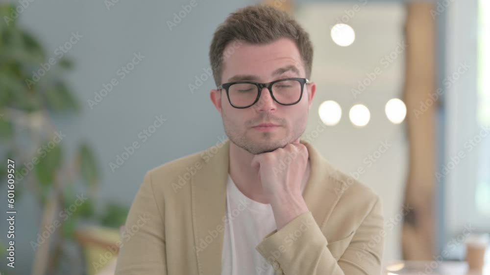 Portrait of Sleeping Young Businessman in Office