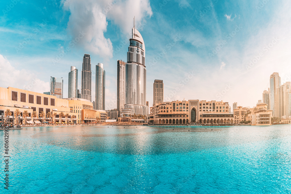 Water pond near the entrance to Dubai Mall and on promenade embankment with skyscrapers in the background