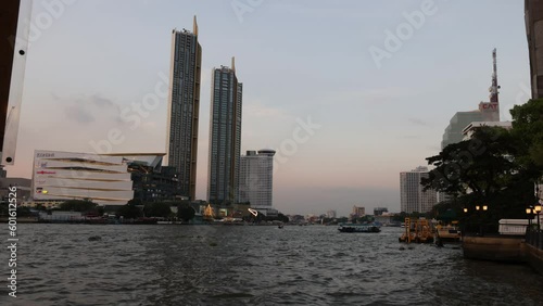 Bangkok, Thailand. December 29, 2022. Time-Lapse Boats on Chaophaya River. photo