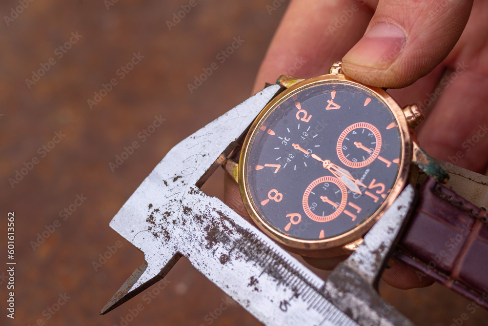time measurement concept moving, watch ticking metal shtangel carefully