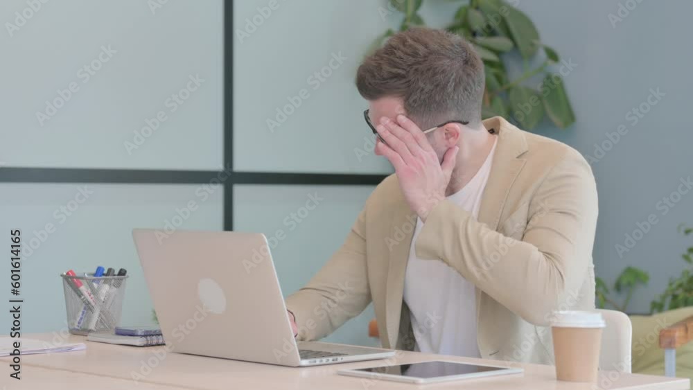 Young Businessman with Headache Working on Laptop Young Businessman with Headache Working on Laptop