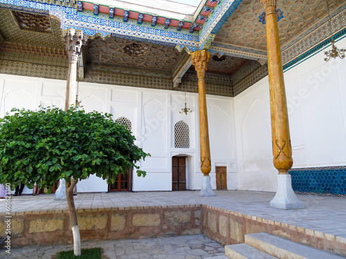 Architectural ensemble with wooden ceiling and columns in Bukhara photo