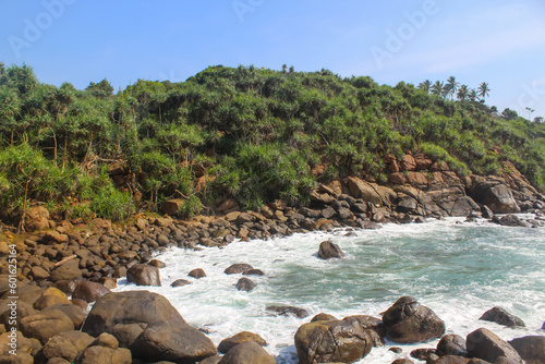 Jungle Beach, Unawatuna.The beach is surrounded by lush greenery and has crystal clear waters that are perfect for swimming and snorkeling.ideal spot for relaxation and taking in the stunning scenery