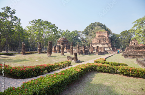 The elaborate Buddhist temple of Wat Mahathat in the historic city of Sukhothai, Thailand photo