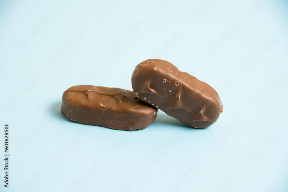 Delicious chocolate bars on a blue background Delicious chocolate bars on a blue background