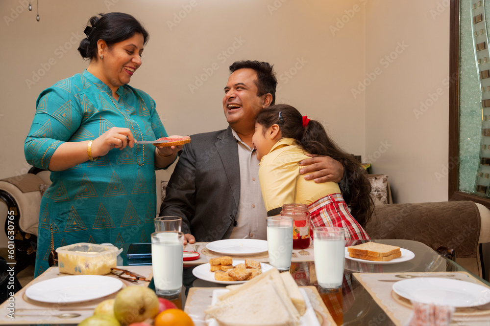 Woman preparing breakfast for her family at home Woman preparing breakfast for her family at home
