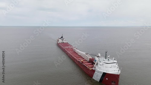 Large natural resources freight shipping vessel transporting minerals along commercial trade route