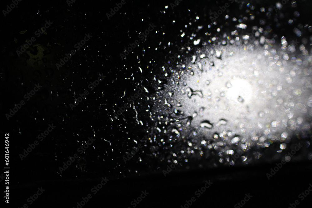 Lens flare effect with wet drop on black background. Overlay, effects sunlight, light leaks Lens flare effect with wet drop on black background. Overlay, effects sunlight, light leaks