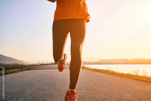 Woman running outdoors. Healthy lifestyle concept, people go in sports. Silhouette family at sunset. Health care, authenticity, sense of balance and calmness. 