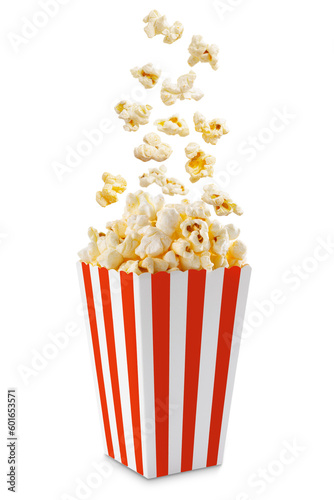 Popcorn flying out of red white striped paper box isolated on white, transparent background, PNG, with copy space. Splash, levitation of popcorn grains.