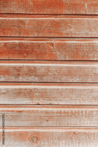 An aged wall background. Wooden brown planks. Close-up of a hardwood tree texture.