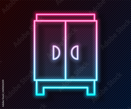 Glowing neon line Wardrobe icon isolated on black background. Cupboard sign. Vector
