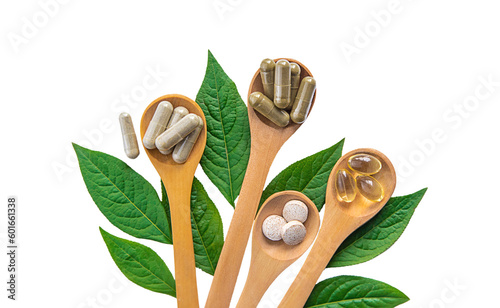 Billede på lærred Herb supplement capsules on green leaf isolate on white background