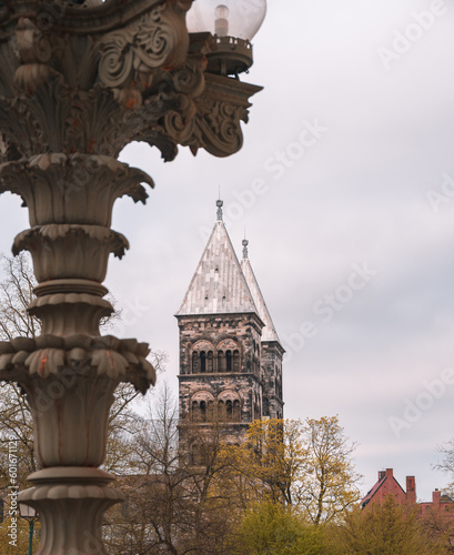Autumn colored trees in front of Lund cathedral towers photo