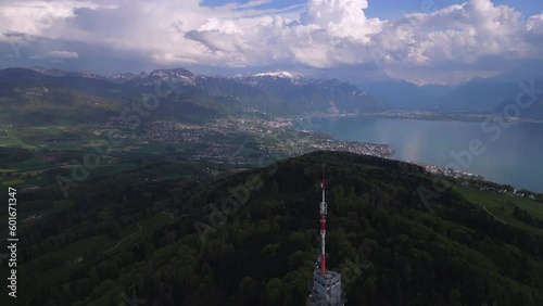 Panning up revealing the Swiss Alps with storm clouds and lake Geneva. 