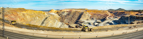 Dump trucks driving along Cerro colorado, the largest active open pit mine in Europa producing copper, silver and several other metal ores