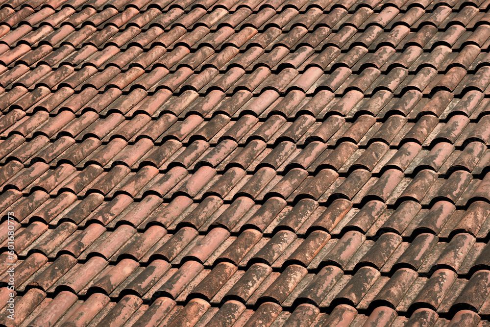 Close-up natural tiled roofs in red color.