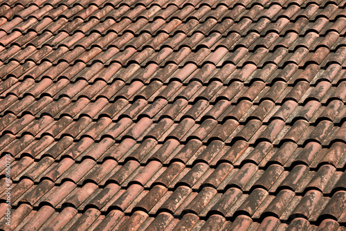 Close-up natural tiled roofs in red color. © SKfoto