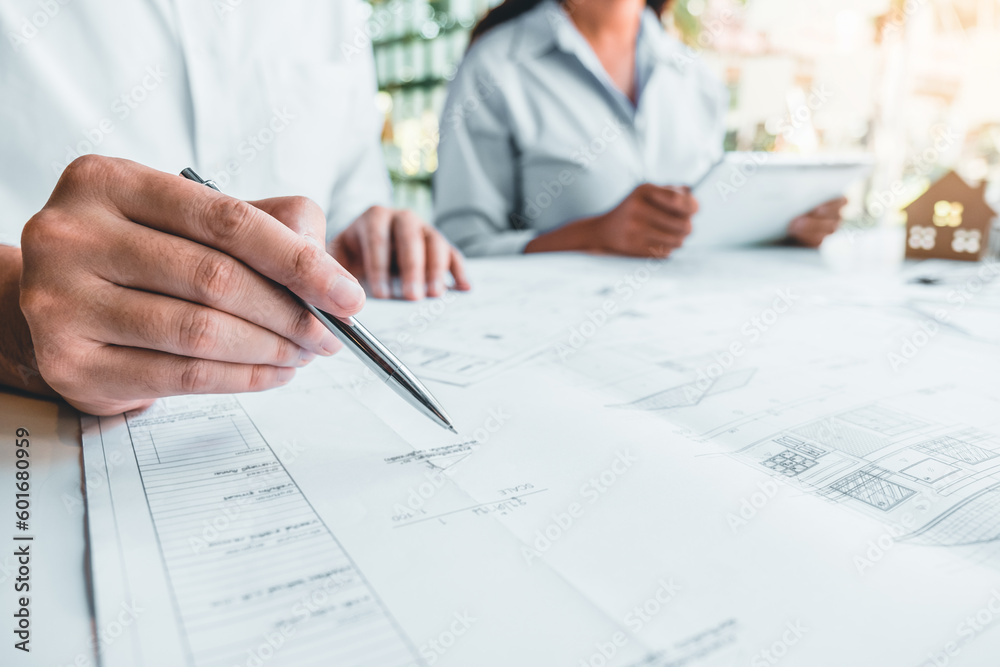 Team Engineer drawing graphic planning and meeting for architectural project on workplace Team Engineer drawing graphic planning and meeting for architectural project on workplace