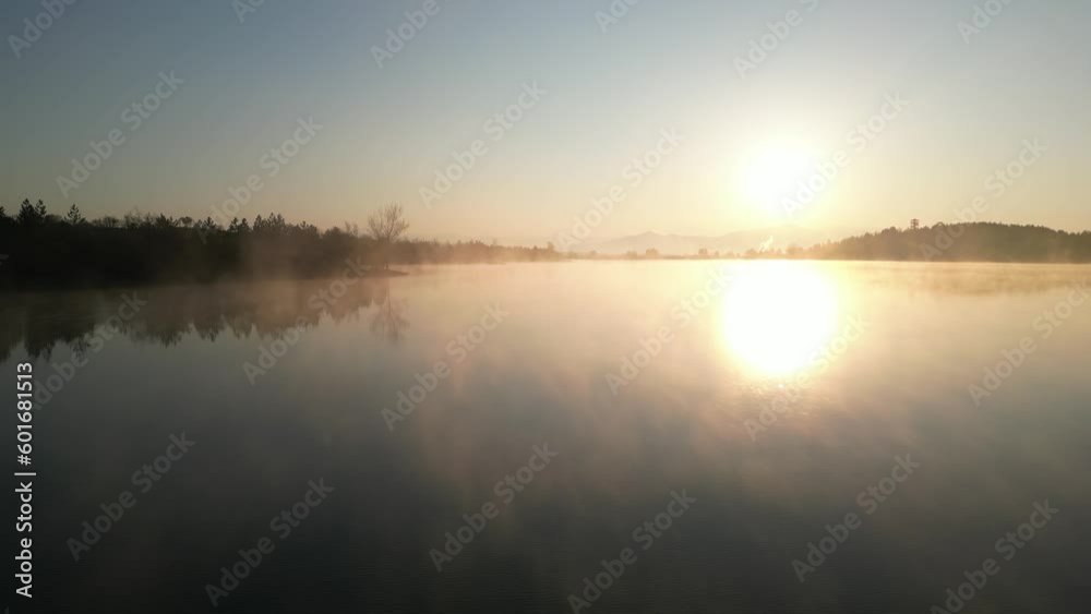 Aerial view of foggy lake surface and sunrise time Aerial view of foggy lake surface and sunrise time