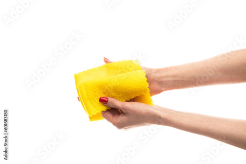 Rag microfiber in female hand with red nails, isolated on a white background