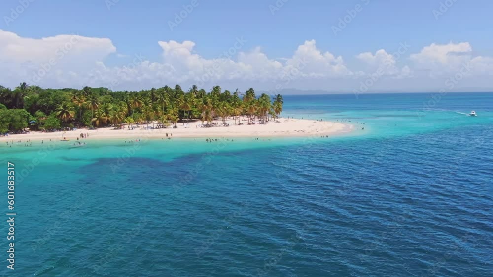 People on white beach of Cayo Levantado or Bacardi Island, Samana in Dominican Republic. Aerial sideways
