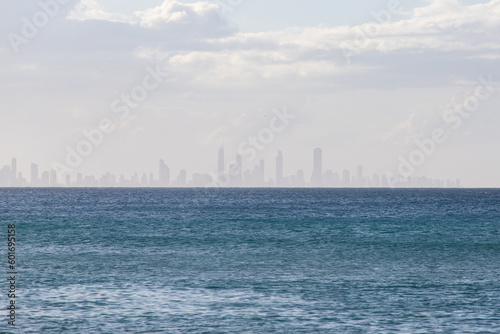 Silhouette of building skyline on the background from the ocean.