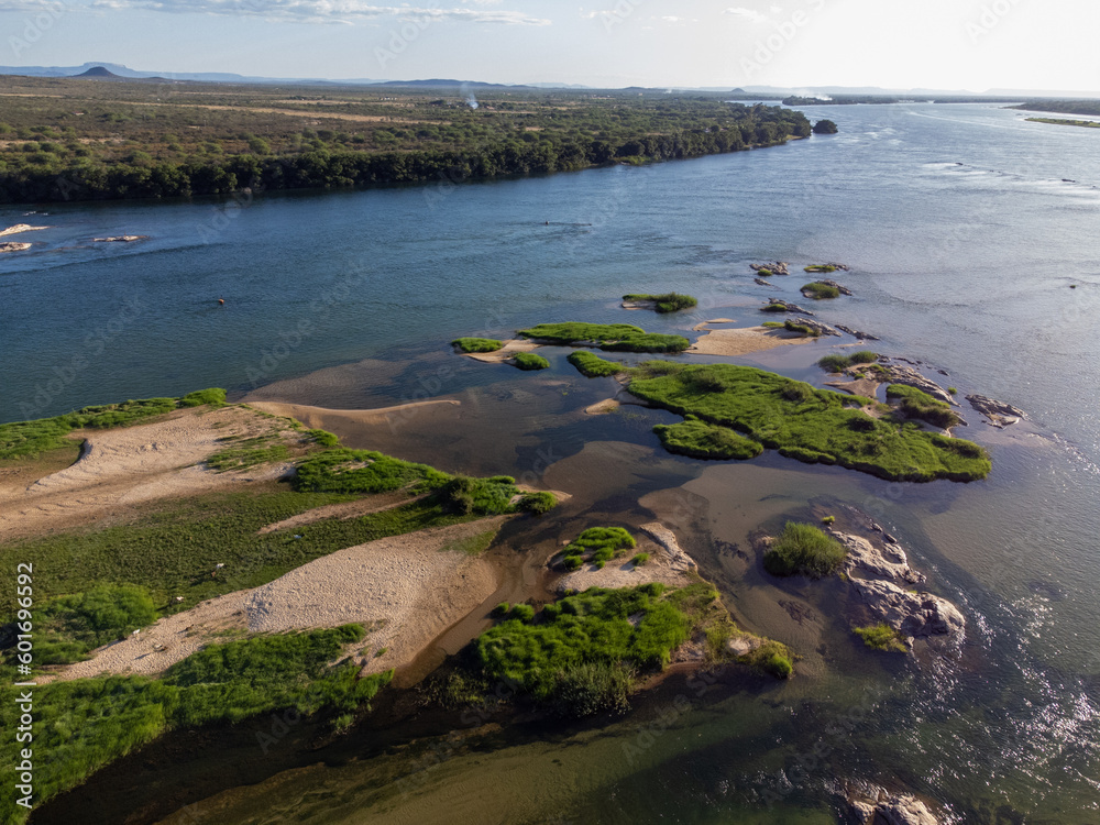 drone top view of beautiful green river with sandbar