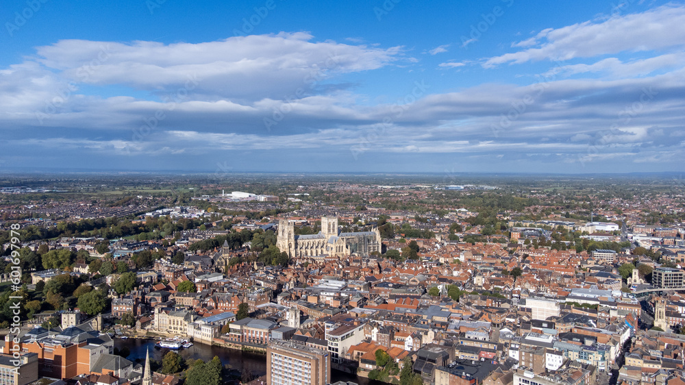 Aerial photo of the town of York located in North East England and founded by the ancient Romans, showing the York Minster Historical Cathedral in the main town centre along the river side.