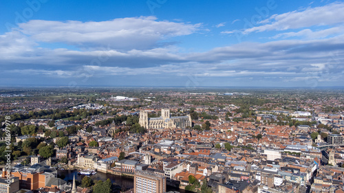 Aerial photo of the town of York located in North East England and founded by the ancient Romans, showing the York Minster Historical Cathedral in the main town centre along the river side.