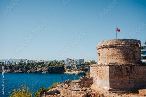 View of the ancient Hidirlik Tower Castle during sunny day in Kaleici, Antalya, Turkey. 